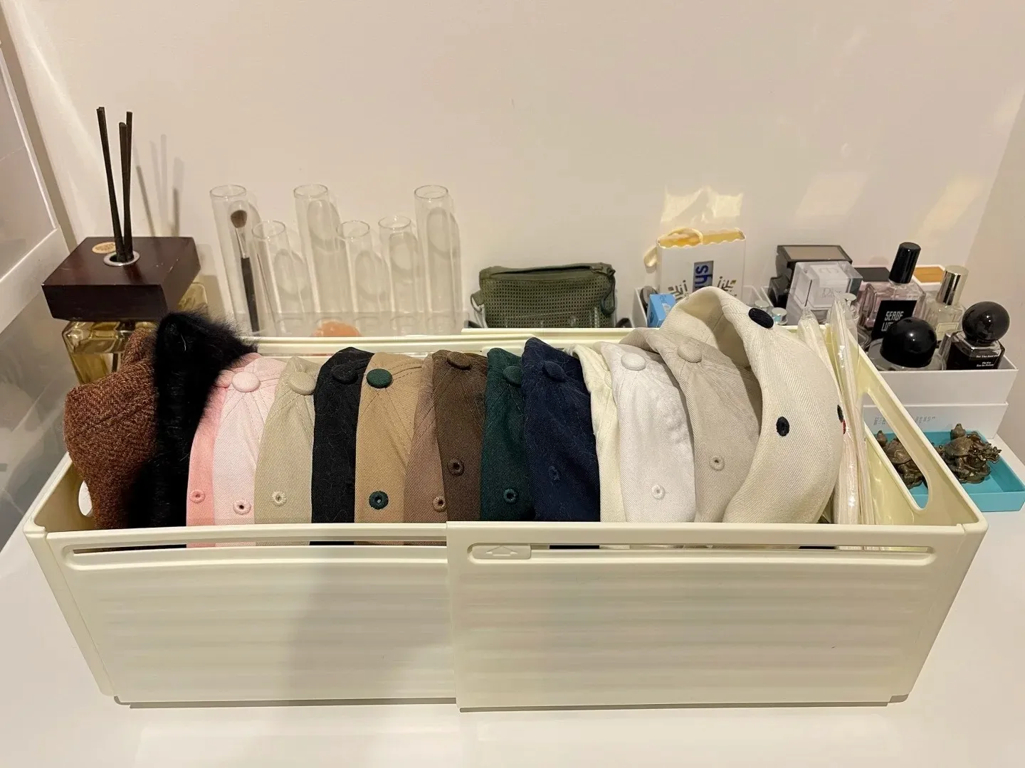 Side-by-side hat storage makes a large collection easier to see and access.